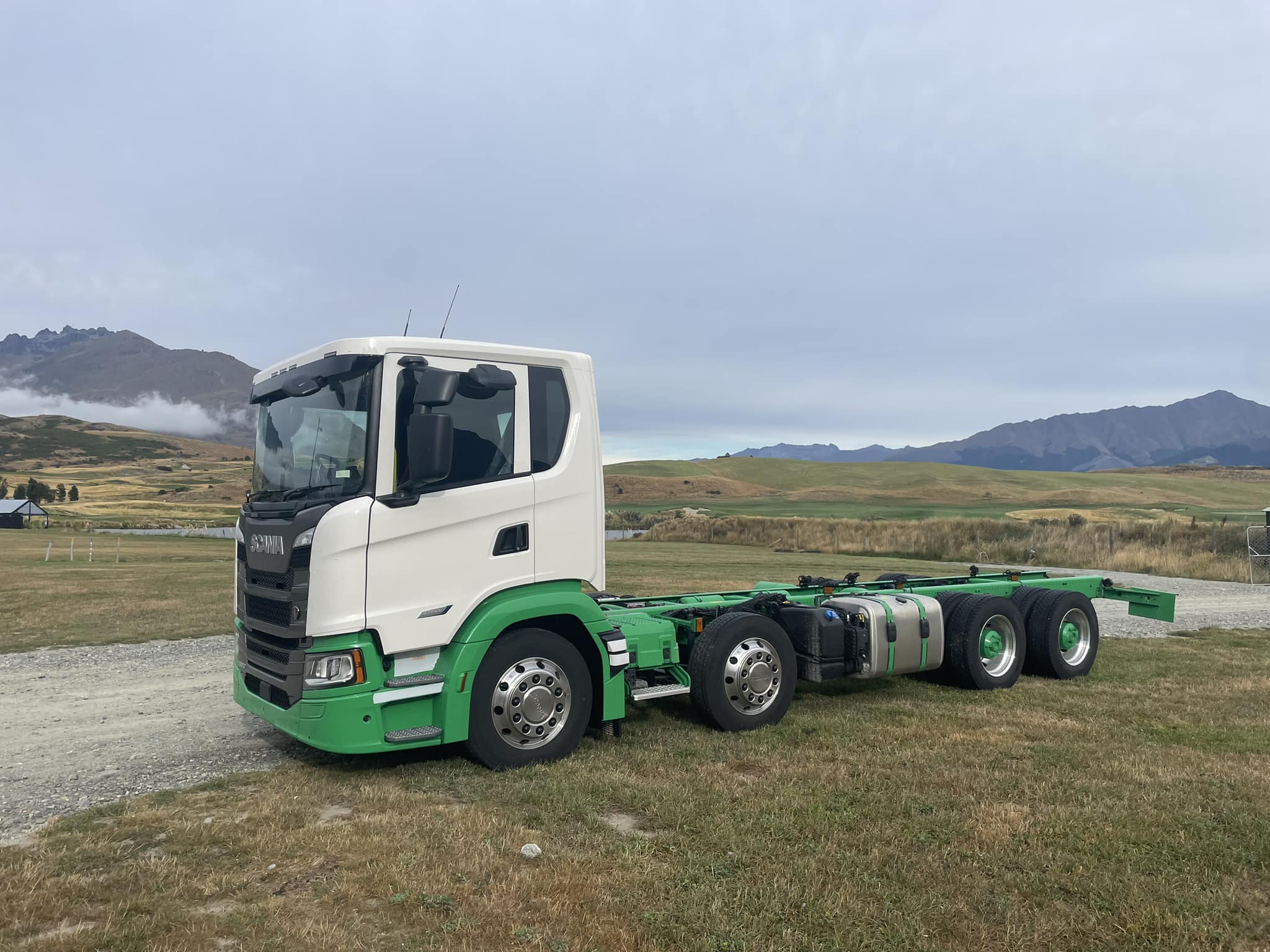 Landscape fleet of white vans parked